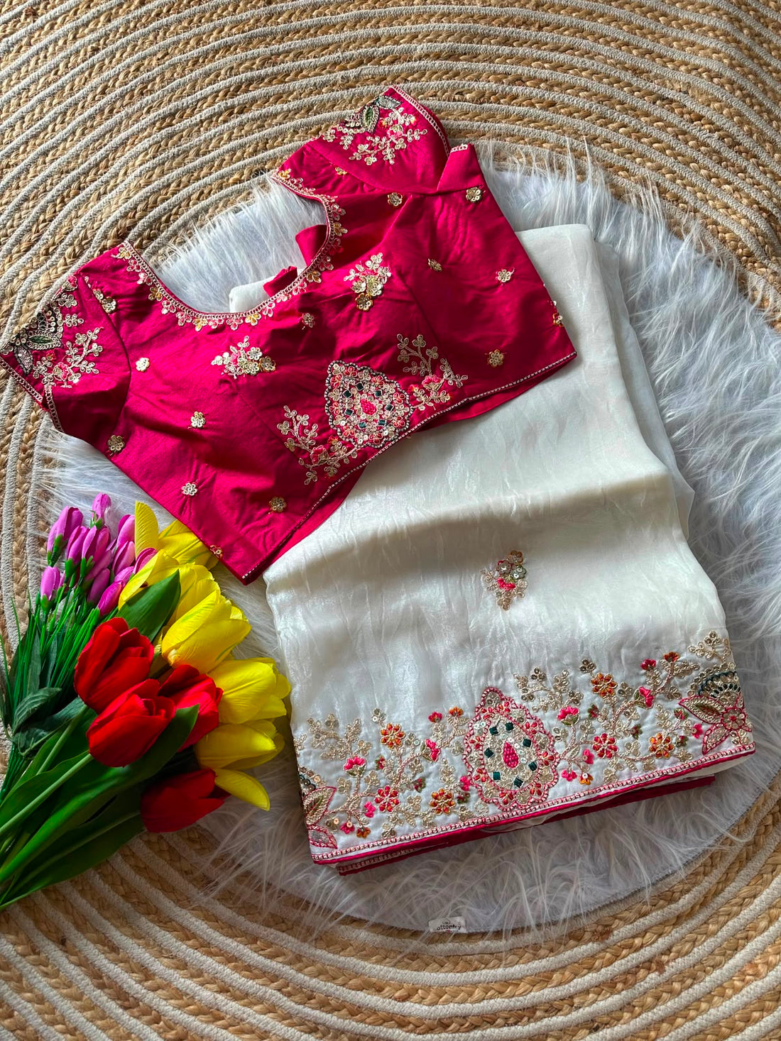 Rich Nylon Fandy silk saree with luxurious shine, beautifully detailed with heavy golden embroidery (Codding dori work with sequins work) all over the border and motifs. Paired with a stylish contrast blouse for a royal festive look.