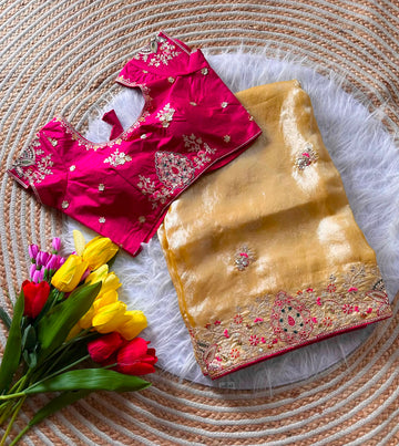 Rich Nylon Fandy silk saree with luxurious shine, beautifully detailed with heavy golden embroidery (Codding dori work with sequins work) all over the border and motifs. Paired with a stylish contrast blouse for a royal festive look.